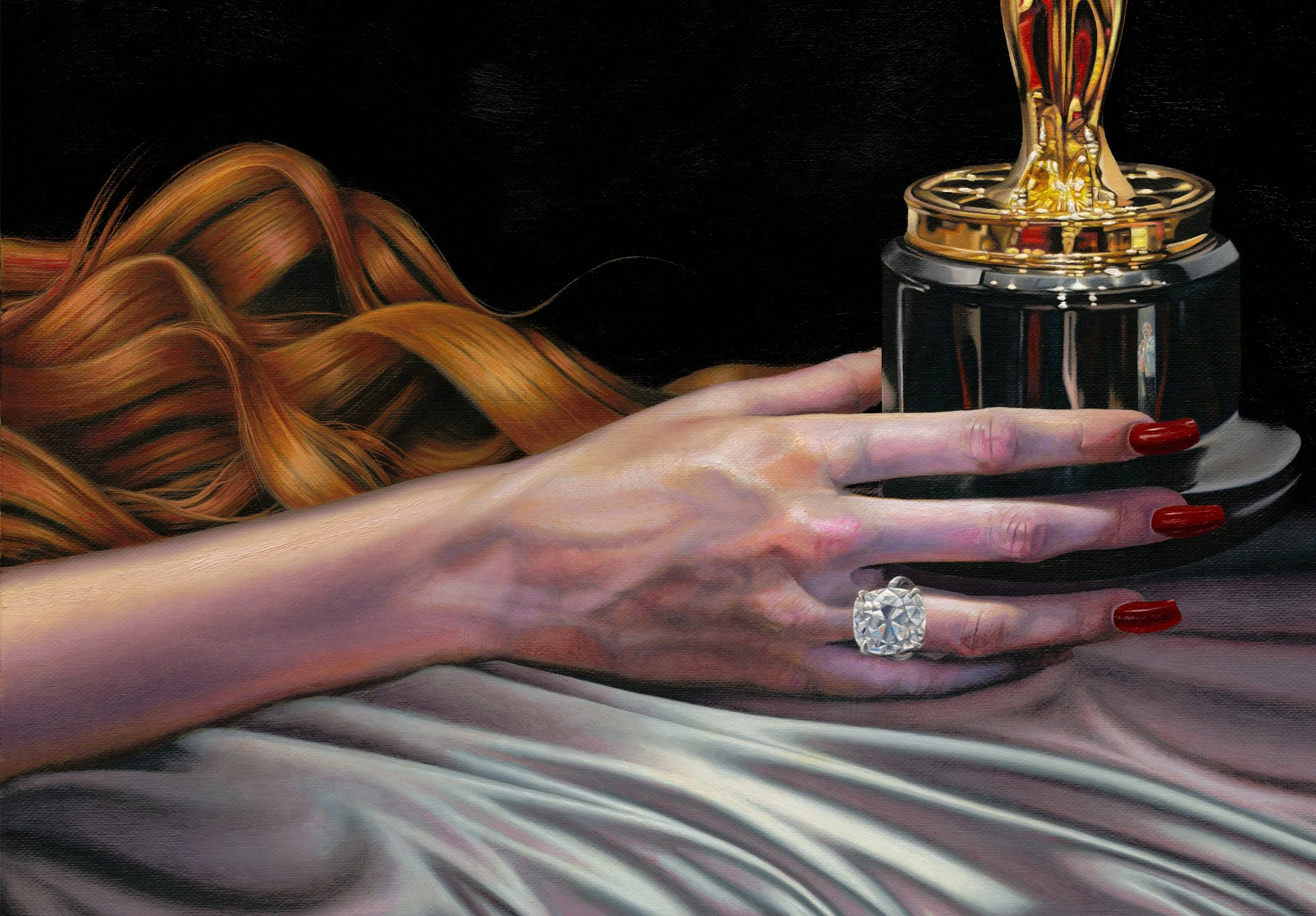 Artistic close-up of manicured hands with red nails and a diamond ring beside an ornate gold-and-black perfume bottle.