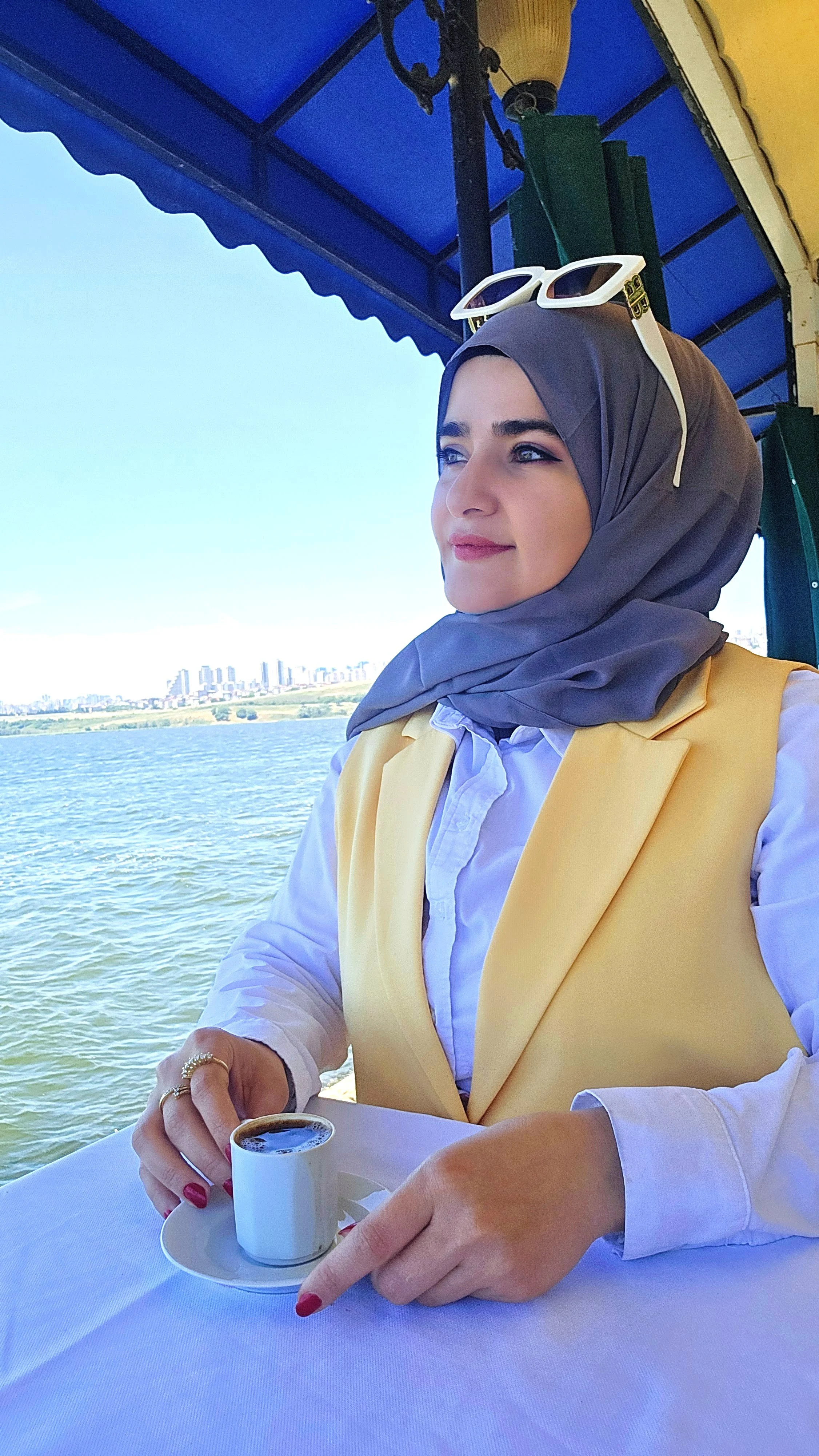 Widad Yahia, Customer Experience Designer, drinking Turkish coffee outdoors in Istanbul