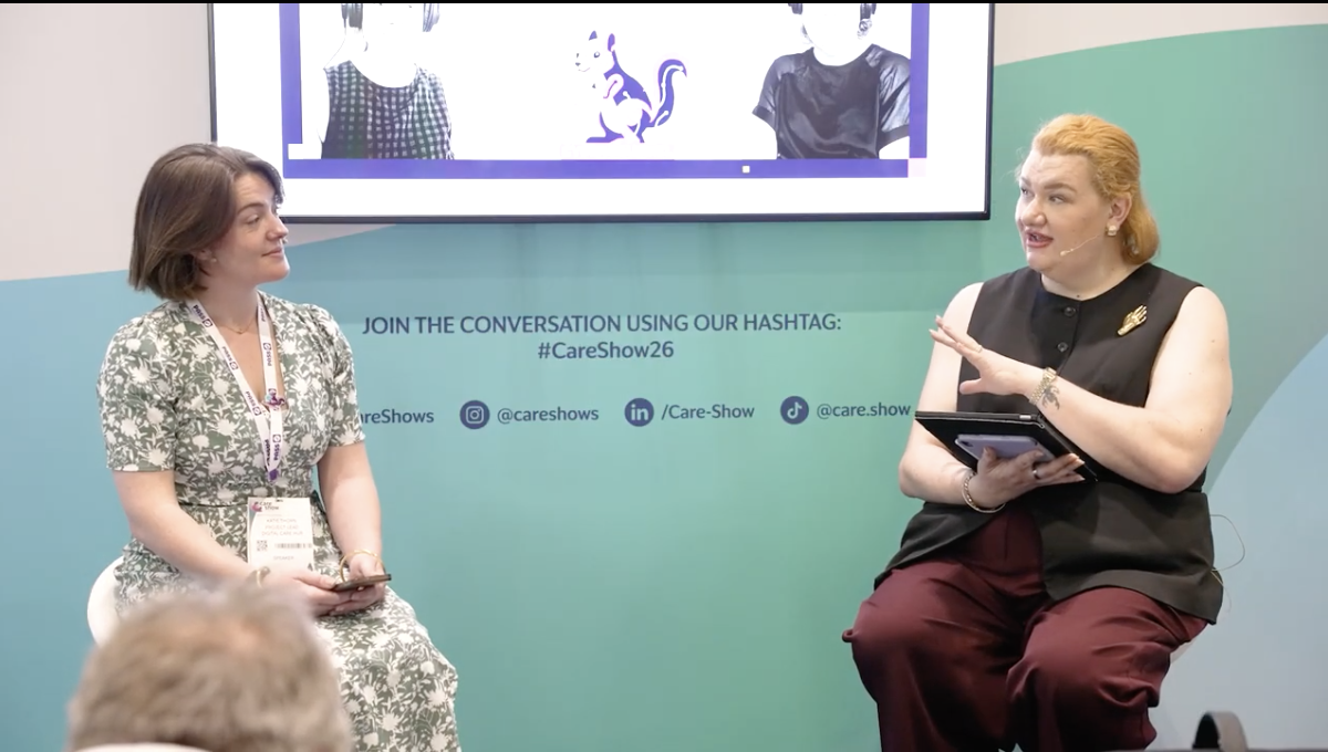 Michelle Corrigan recording the Ctrl+Care podcast live at a conference
