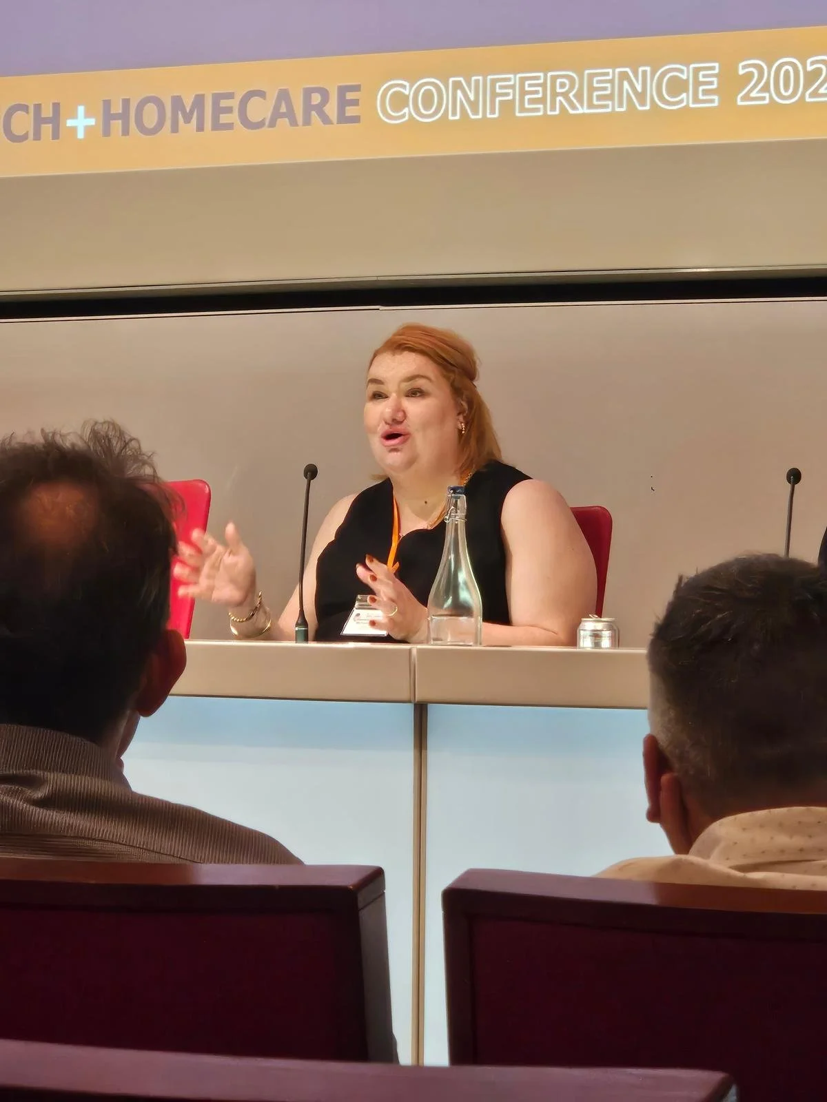 Michelle Corrigan, founder of People Shaped Work, speaking at a conference