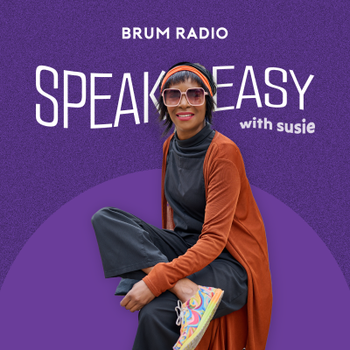 A woman wearing sunglasses, a headband, a black outfit, and a brown cardigan, sitting with one leg crossed over the other, holding a colorful book against a purple background with text about a radio show.