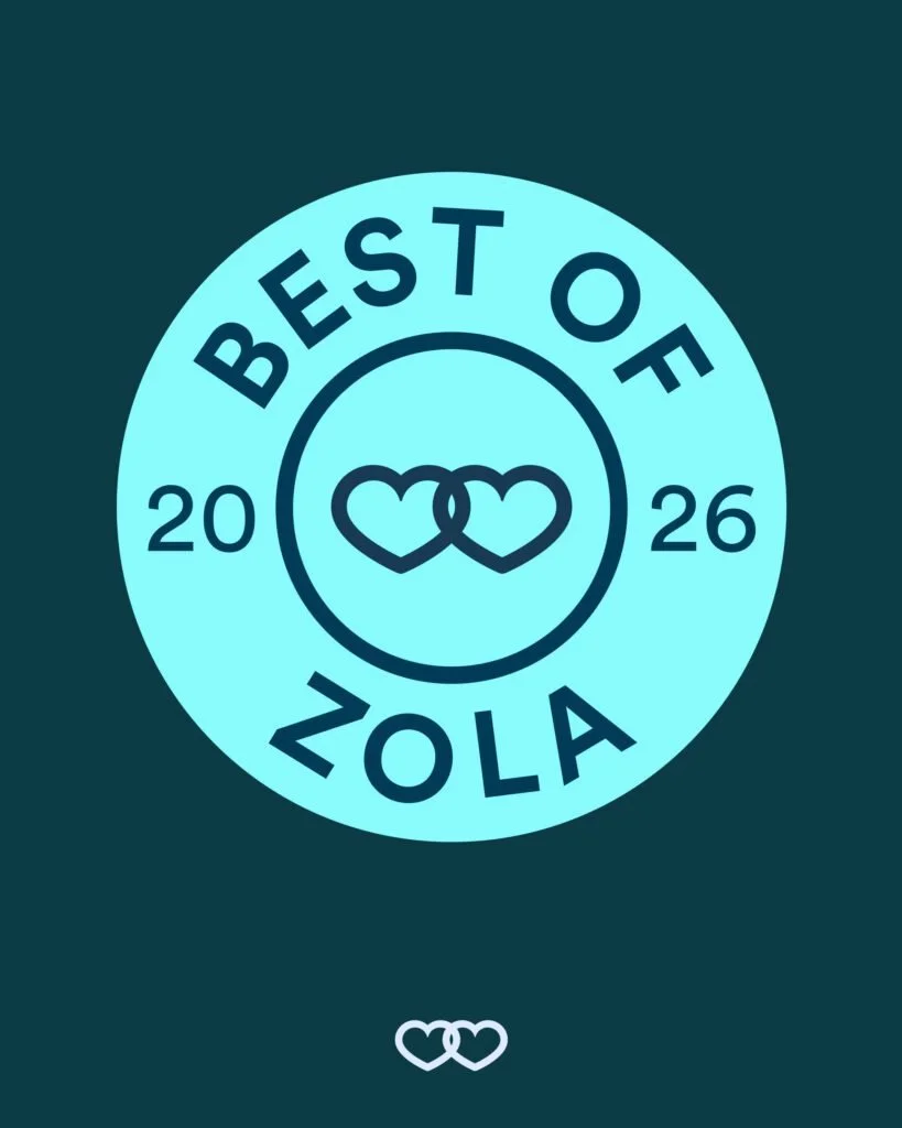Turquoise circular graphic reading “BEST OF ZOLA 2026” with two interlocking hearts in the center and a small white heart icon below.