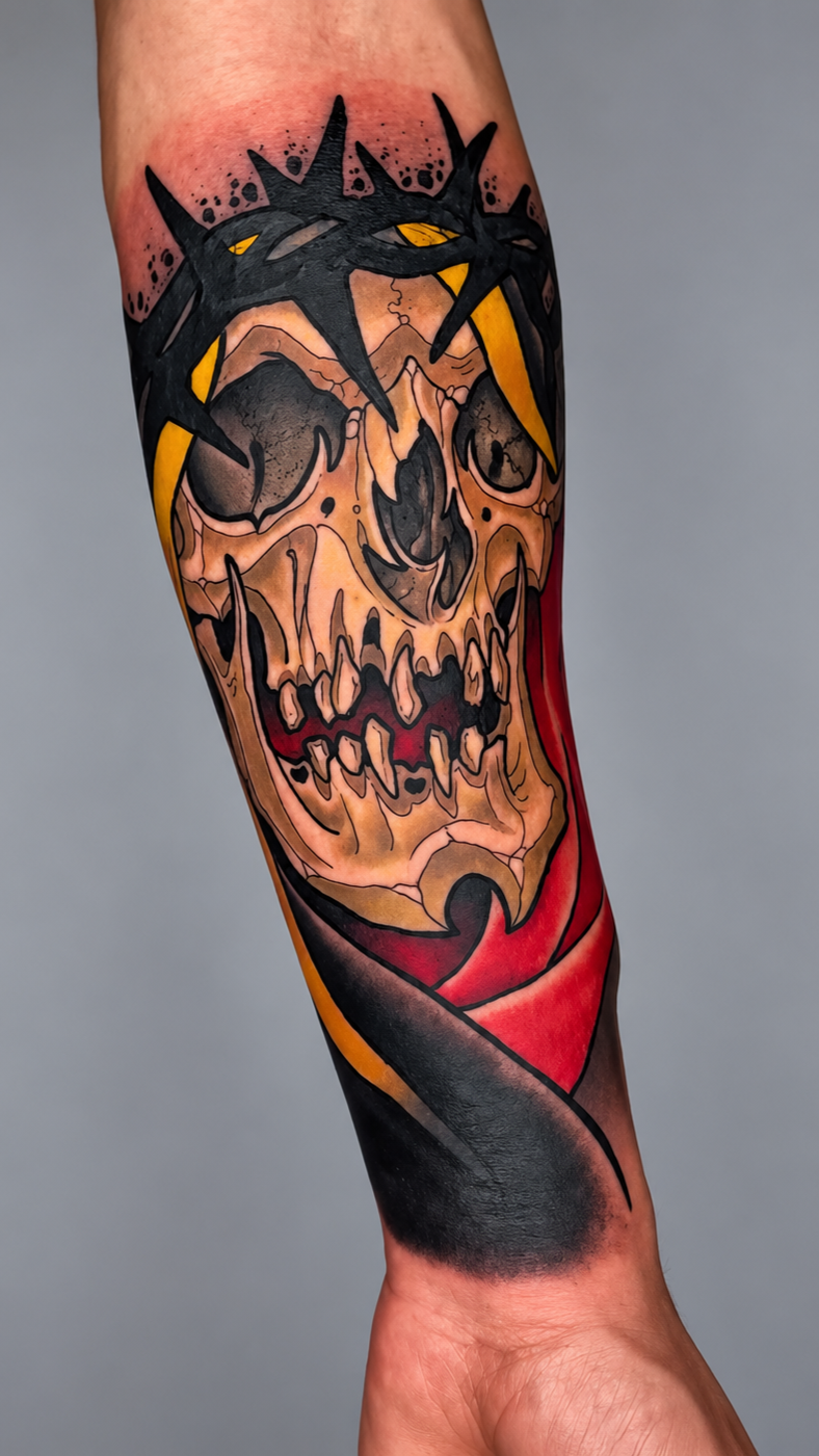 Color reaper skull tattoo with black thorn crown and red accents by Miami tattoo artist Adrian Aguirre