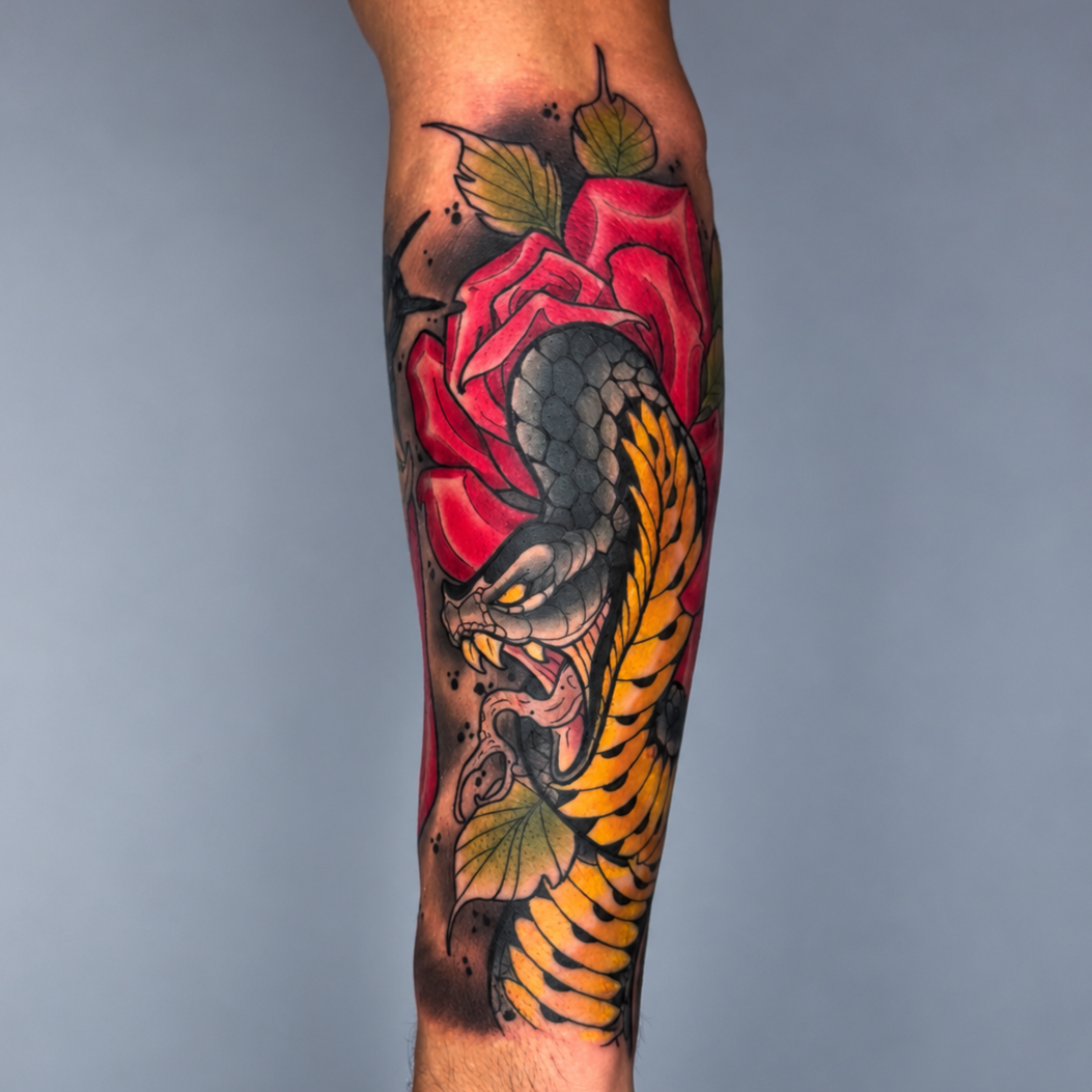 Color snake and rose forearm tattoo by Miami tattoo artist Adrian Aguirre
