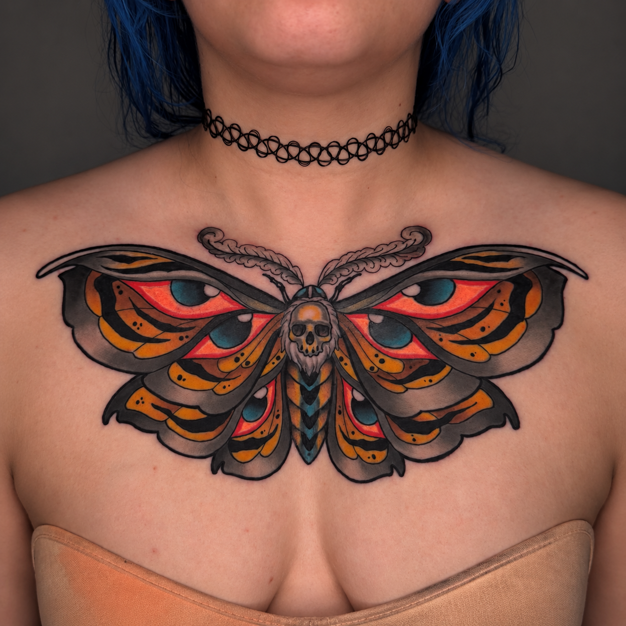 Color neo-traditional moth chest tattoo by Miami tattoo artist Adrian Aguirre