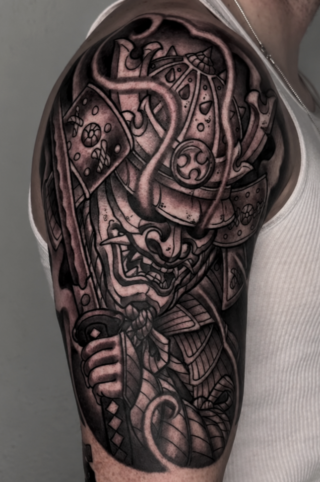 Black and gray samurai warrior tattoo with armor and sword by Miami tattoo artist Adrian Aguirre