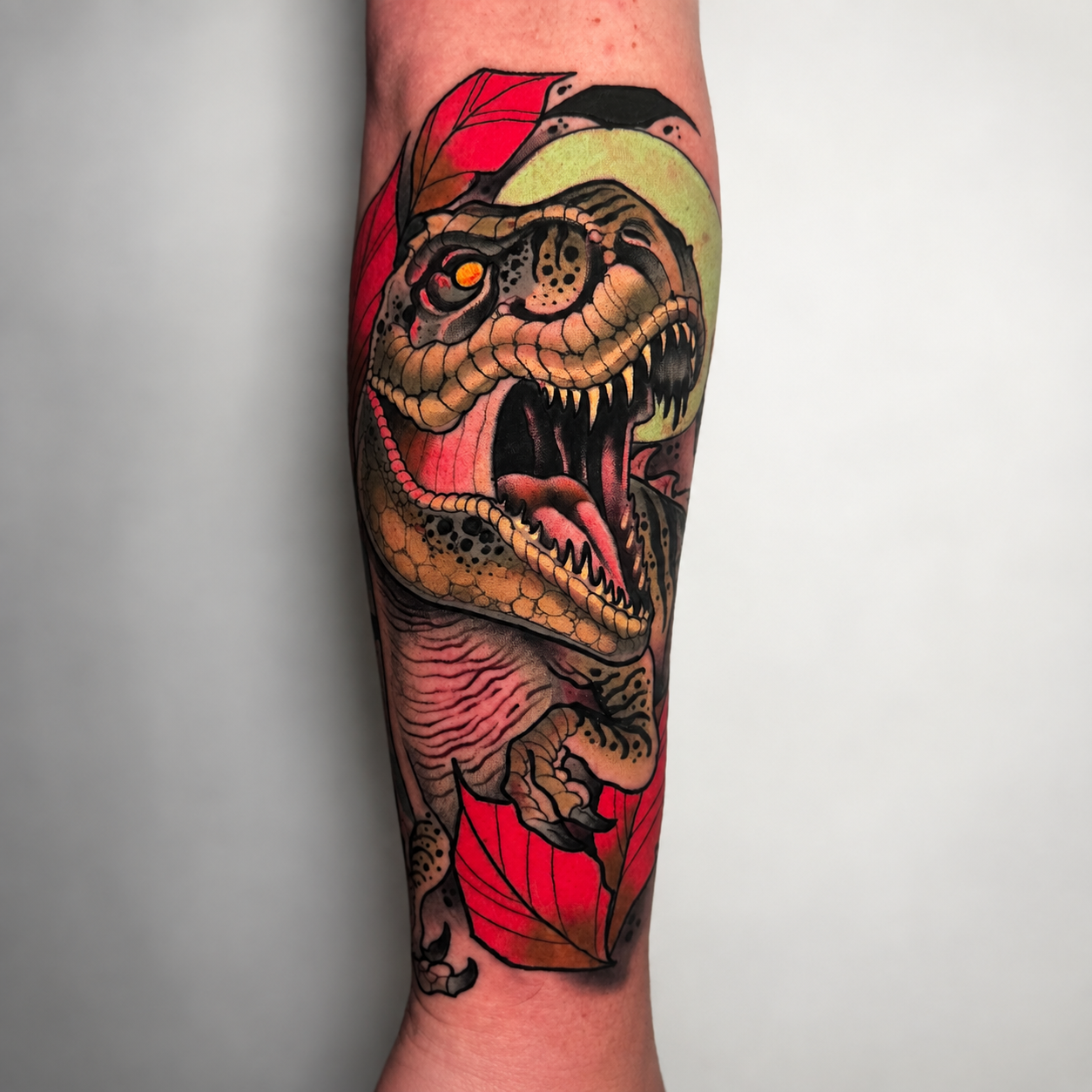 Color neo-traditional T-rex tattoo by Miami tattoo artist Adrian Aguirre