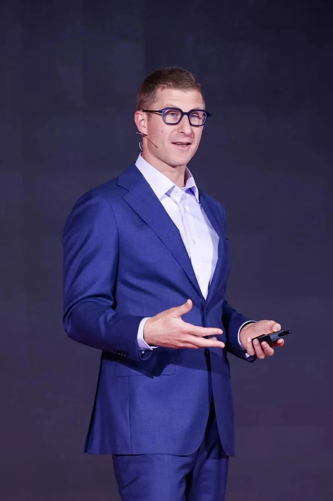 JR speaking at a conference in Hong Kong