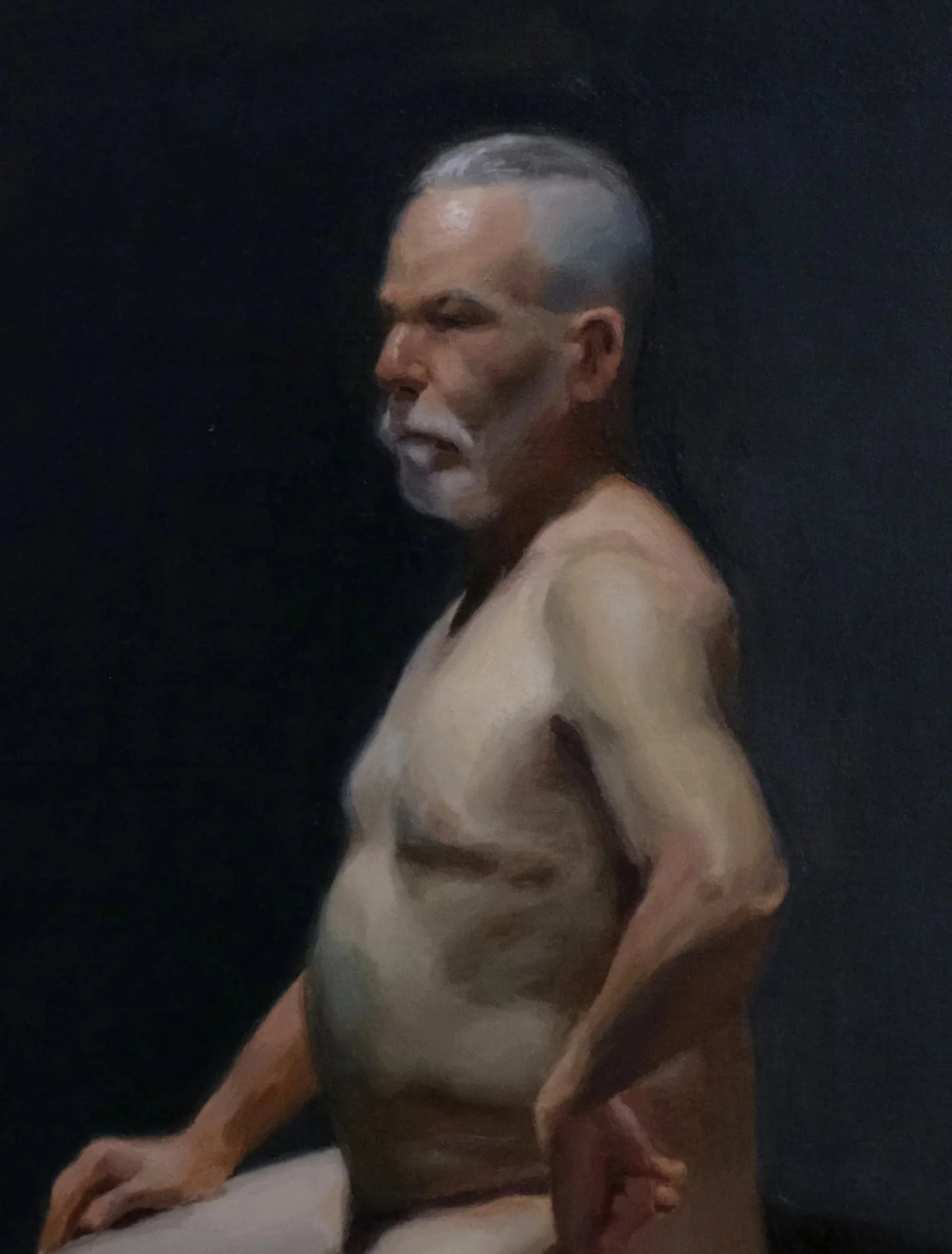 A painting of a nude man with gray hair, a mustache, and a beard against a dark background.