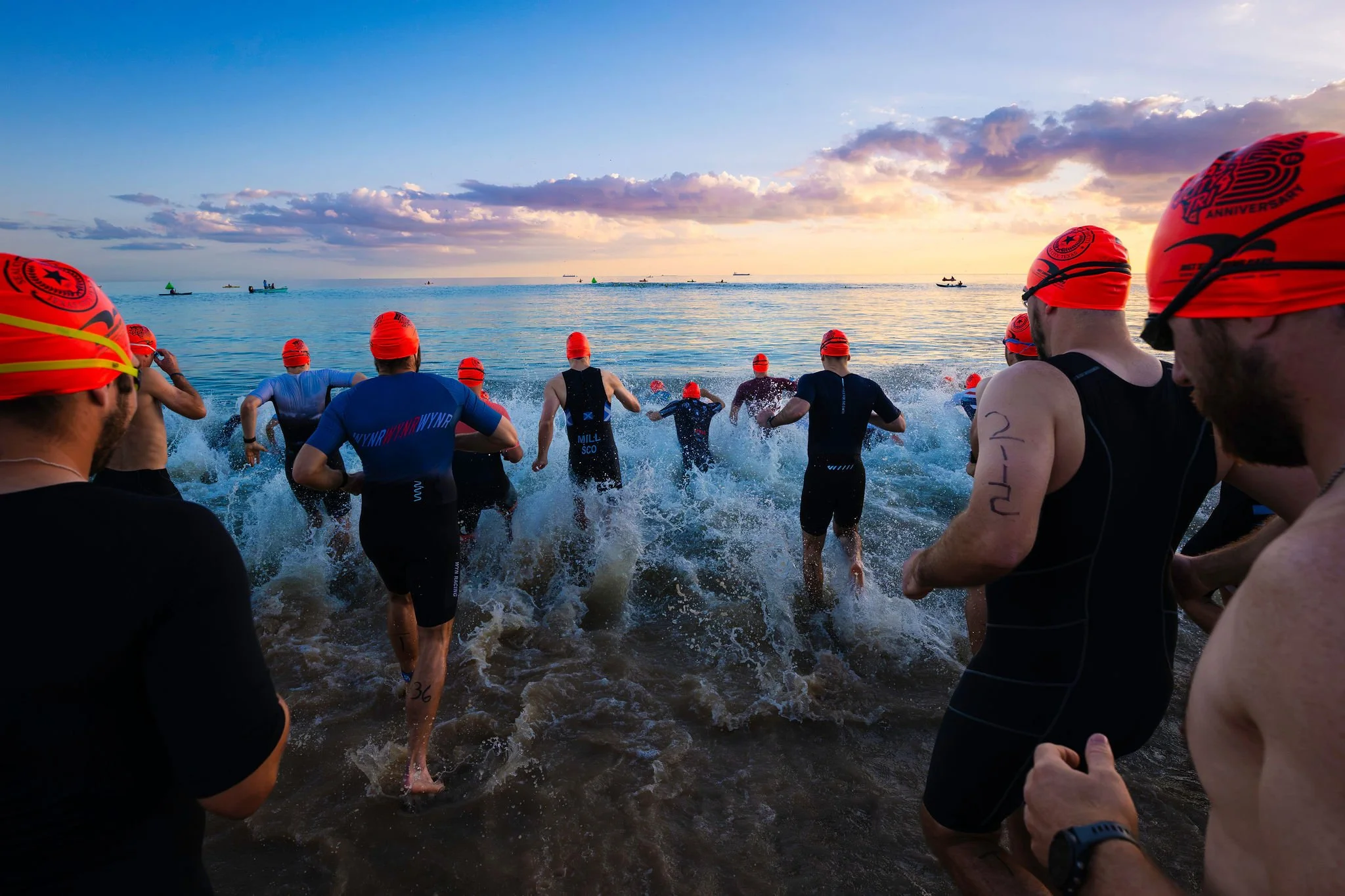 Swimmers entering Galveston Bay