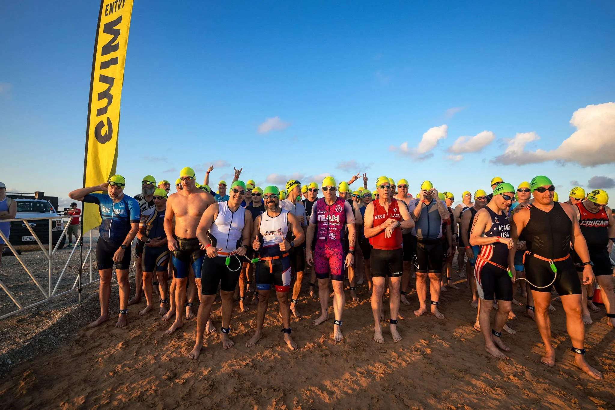 Swimmers lined up on the beach