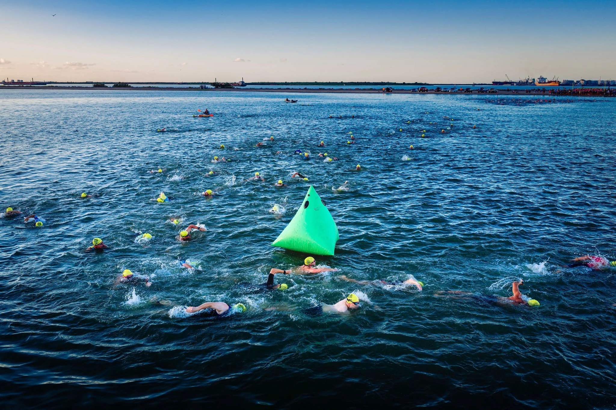 Open-water swimmers rounding a buoy