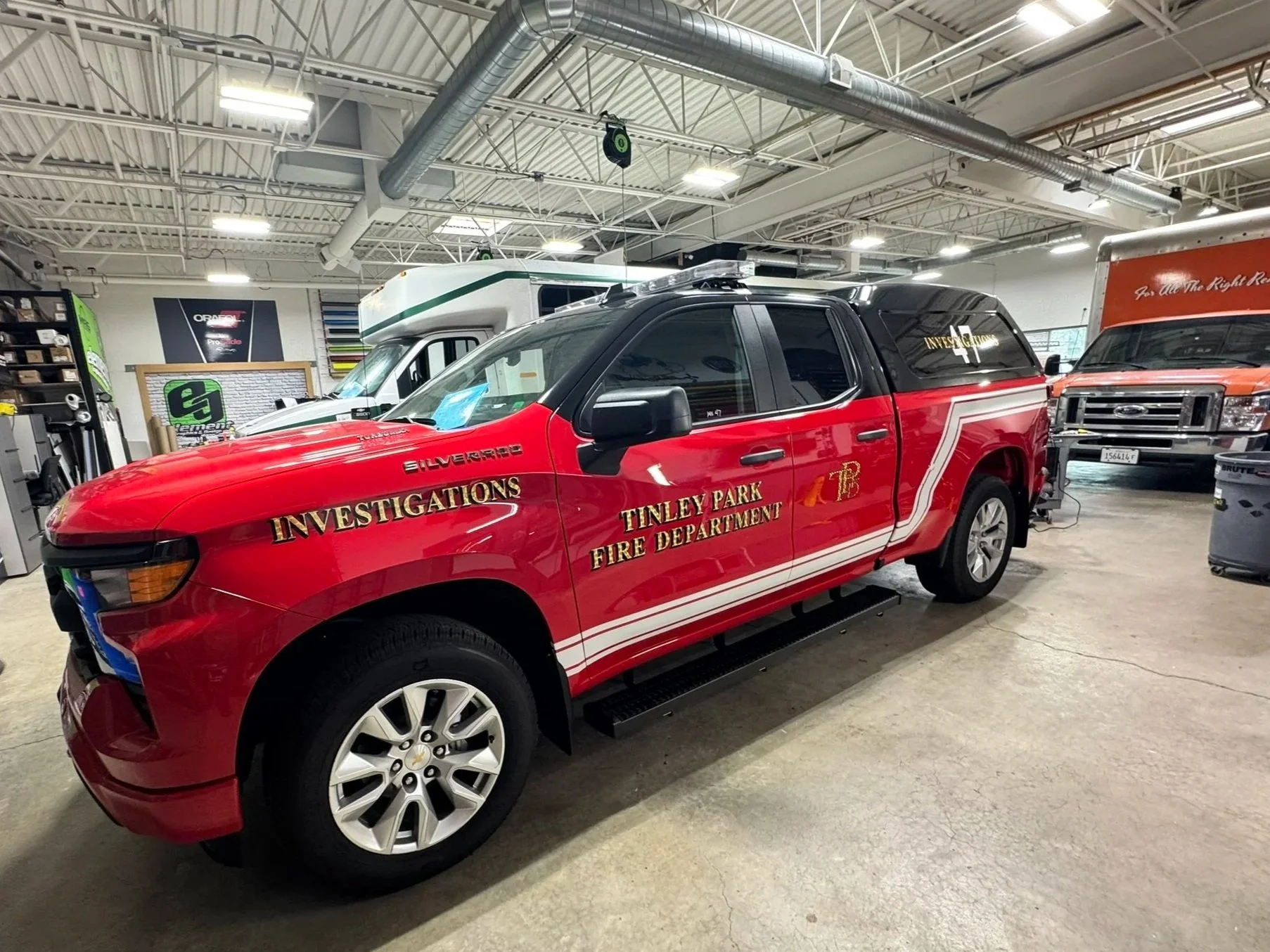 Tinley Park Fire Department investigations pickup truck with red and white emergency vehicle graphics