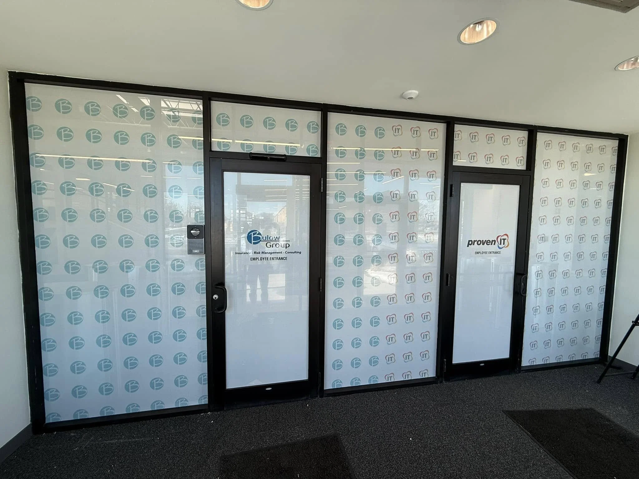 Office glass doors and windows with branded etched privacy film for Bulow Group and Proven IT