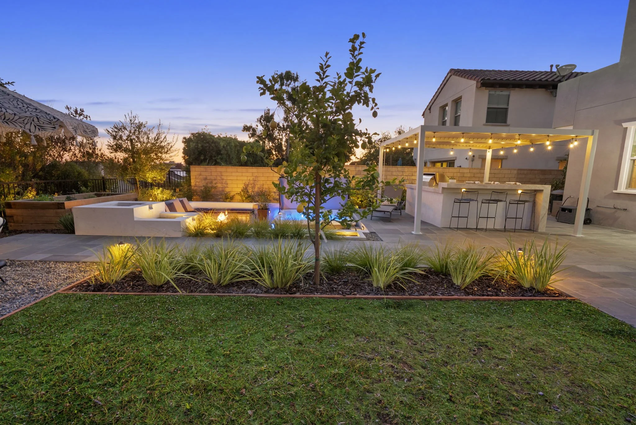 Backyard outdoor living landscape with lawn patio and garden areas