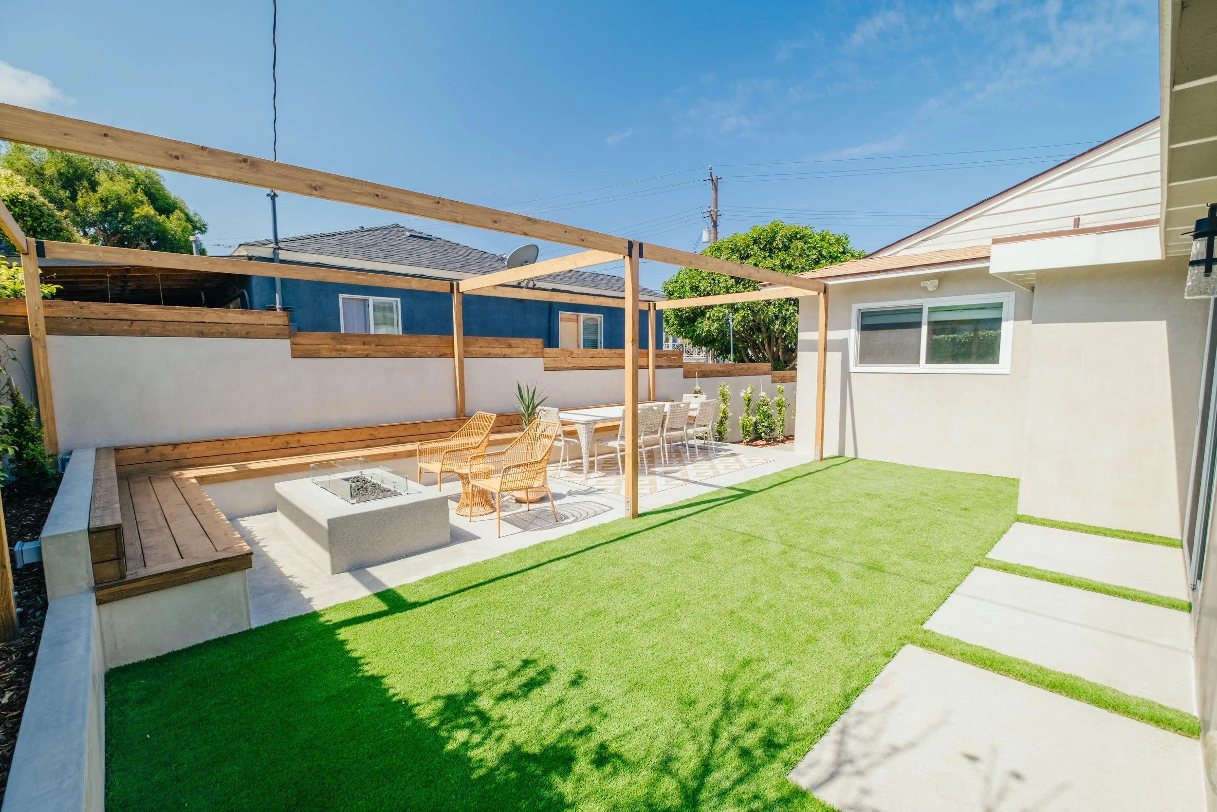 Backyard lawn and outdoor living landscape designed by Rosewood Landscape