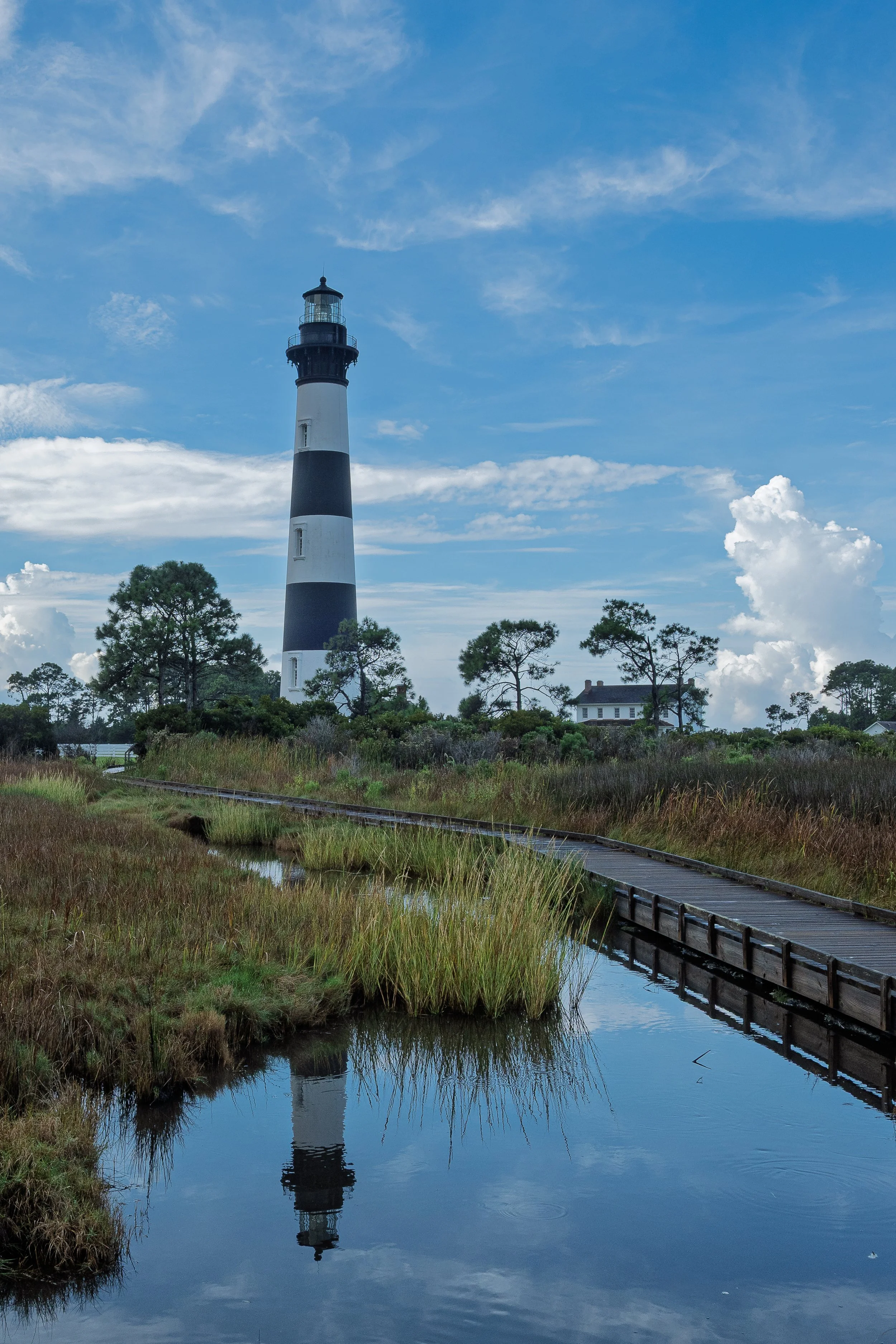 Buxton Lighthouse reflecting in the water, boardwalk to guide your way