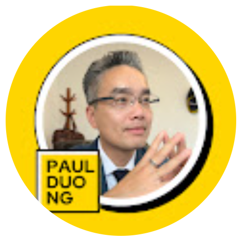 A man with gray hair and glasses, wearing a suit and tie, with his hands clasped in front of him, positioned inside a circular yellow frame. The frame has a small square in the bottom left corner with the text 'PAUL DUONG' in black letters.