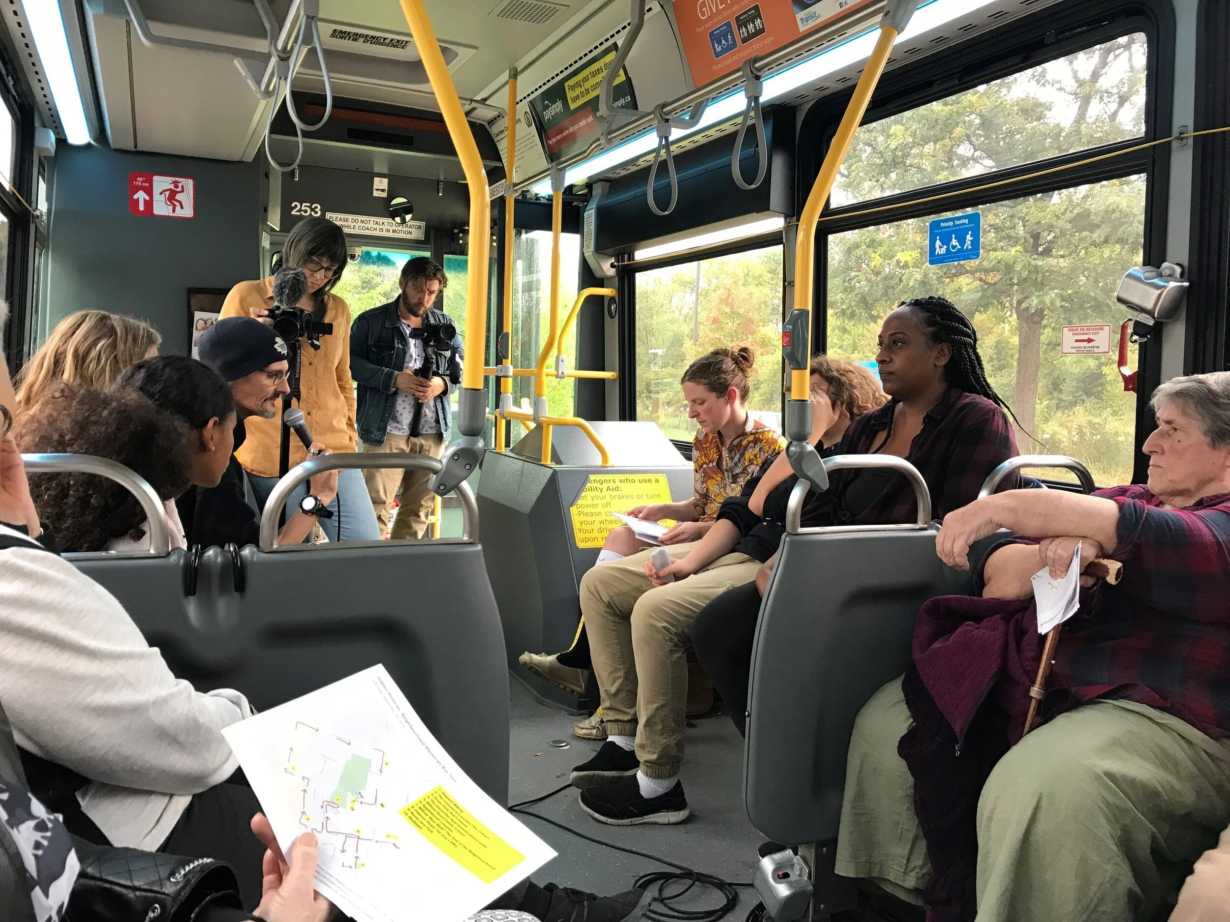 Resident of the Onward Willow neighbourhood shares a story during the 2019 Moving Histories/Neighbourhood Mysteries bus tour.