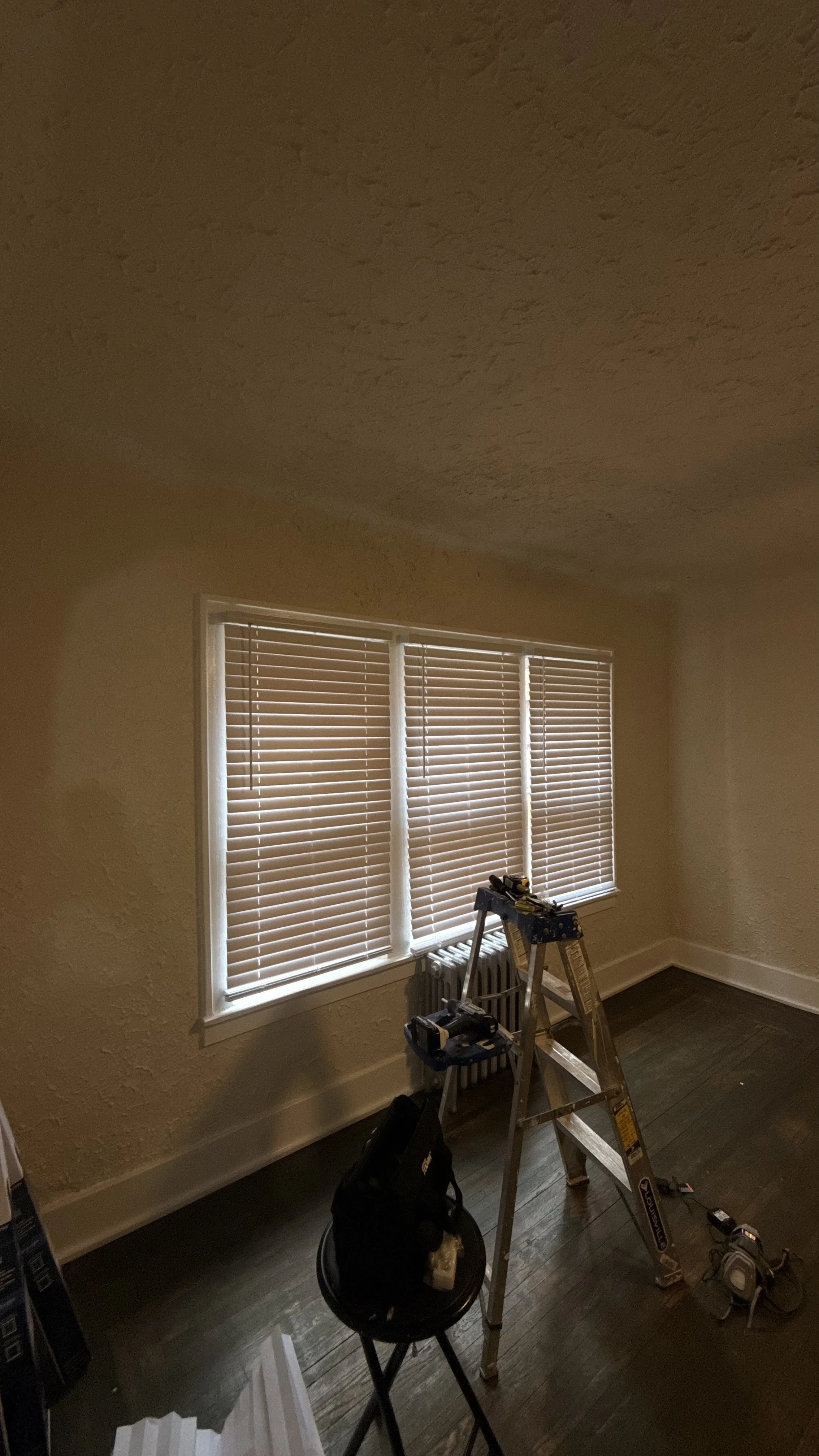 Residential window blinds installed during a home improvement project.
