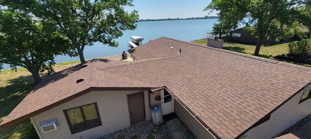 Lakeside home roof replacement with a private dock near Harrisburg, South Dakota