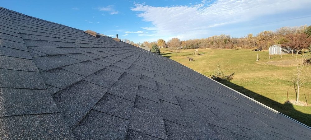 Rural acreage roof replacement overlooking open fields in southeastern South Dakota