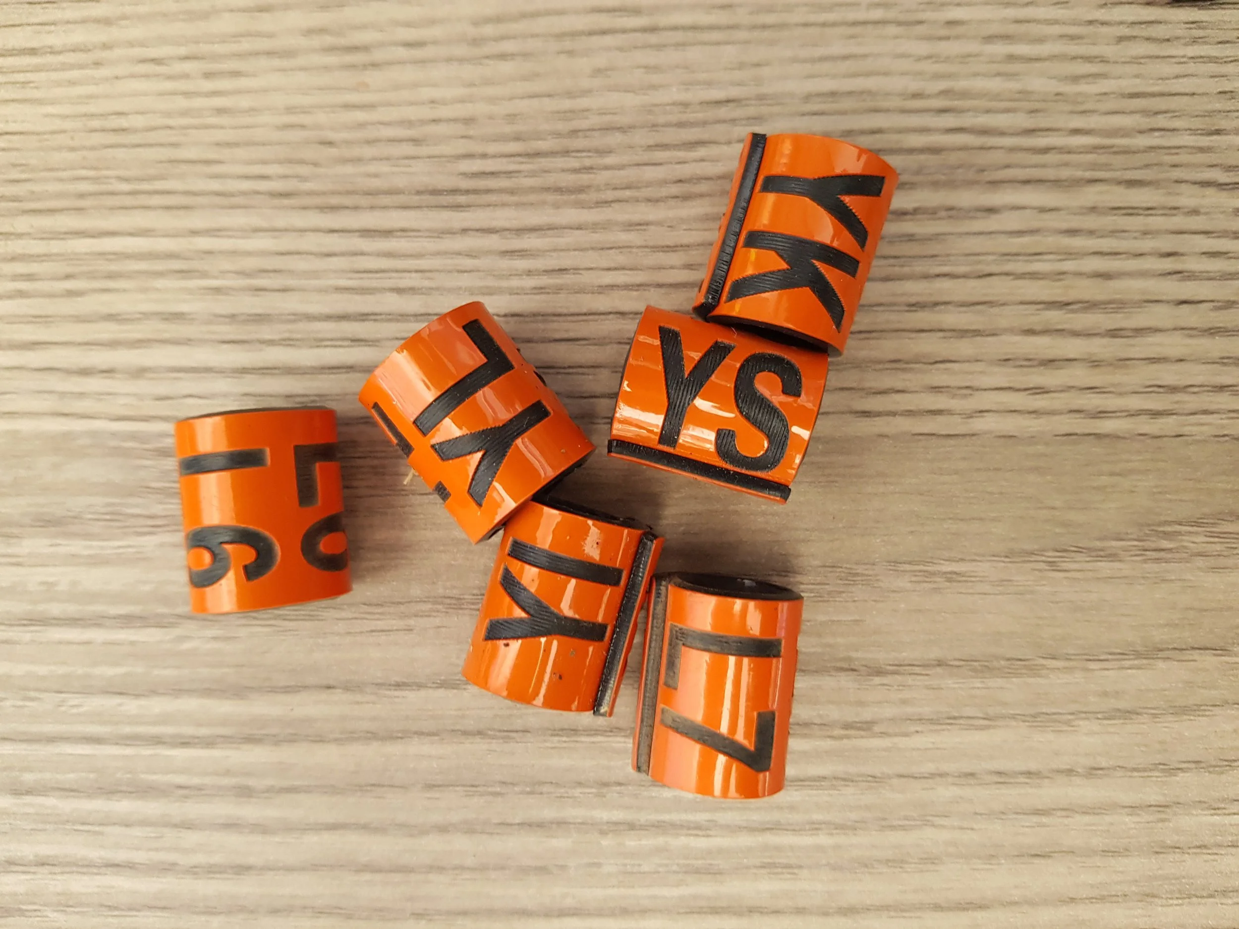 Close-up of several orange rings one of which is L7
