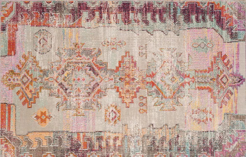 A vintage woven rug with geometric patterns and a mix of pastel and earthy colors.