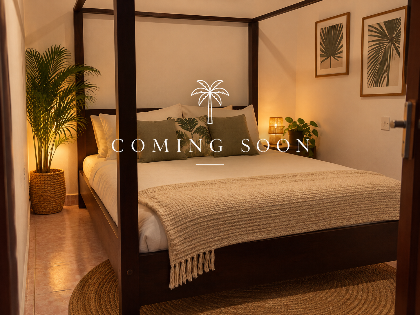 A cozy bedroom with a four-poster bed, green throw pillows, a beige blanket, potted plants, and framed leaf art on the wall. There is warm lighting from lamps on either side of the bed. Text overlay says 'Coming Soon' with a palm tree icon.
