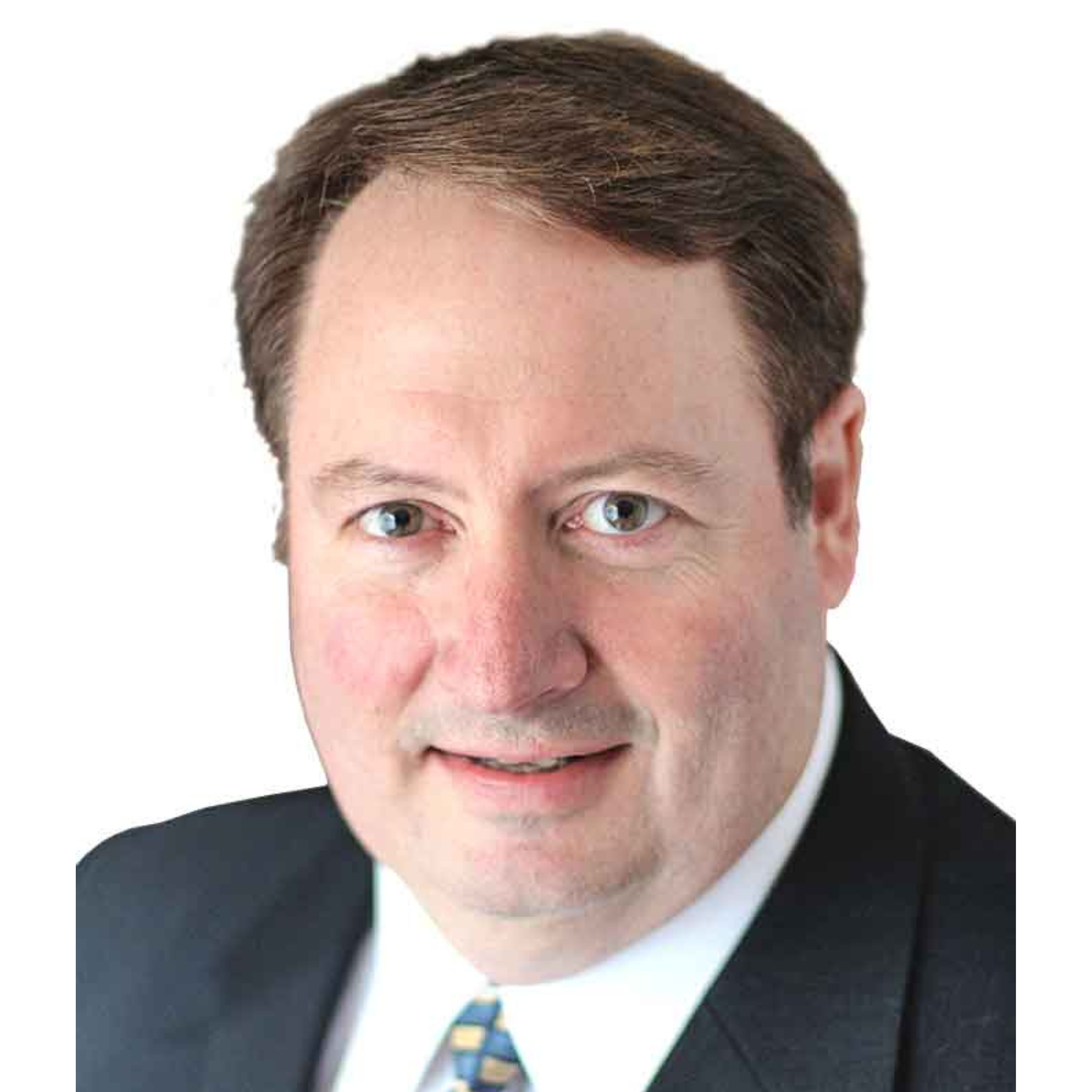 Close-up of a man with brown hair, wearing a black suit, white shirt, and a colorful striped tie.