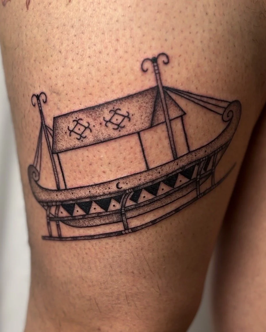 Line art tattoo of a Viking ship with detailed patterns on the hull and sails, located on skin.