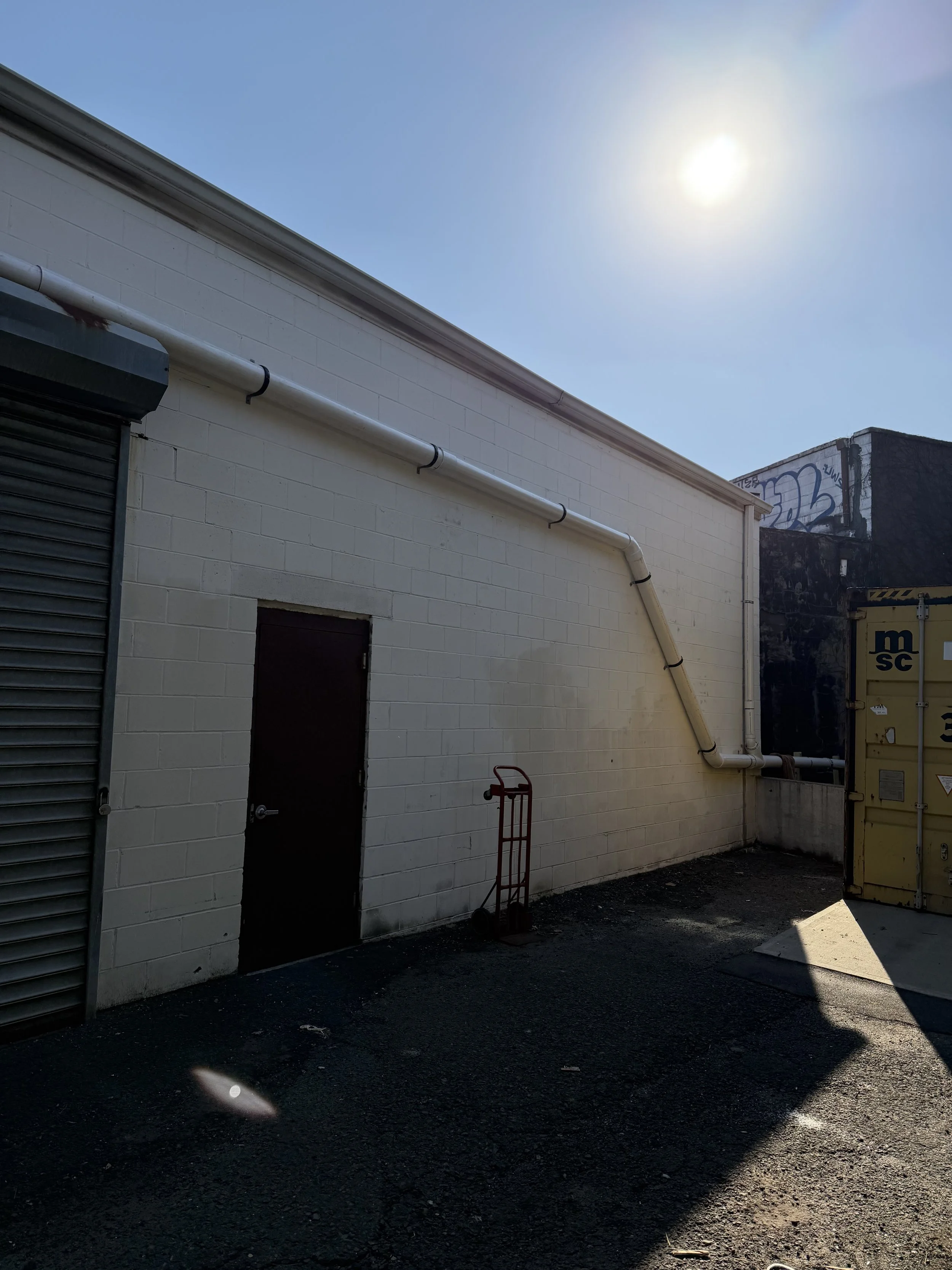 Commercial Roof Drainage Installation:
Installation of approximately 200 LF of piping to redirect roof runoff from existing gutters to a designated ground-level drainage area.
