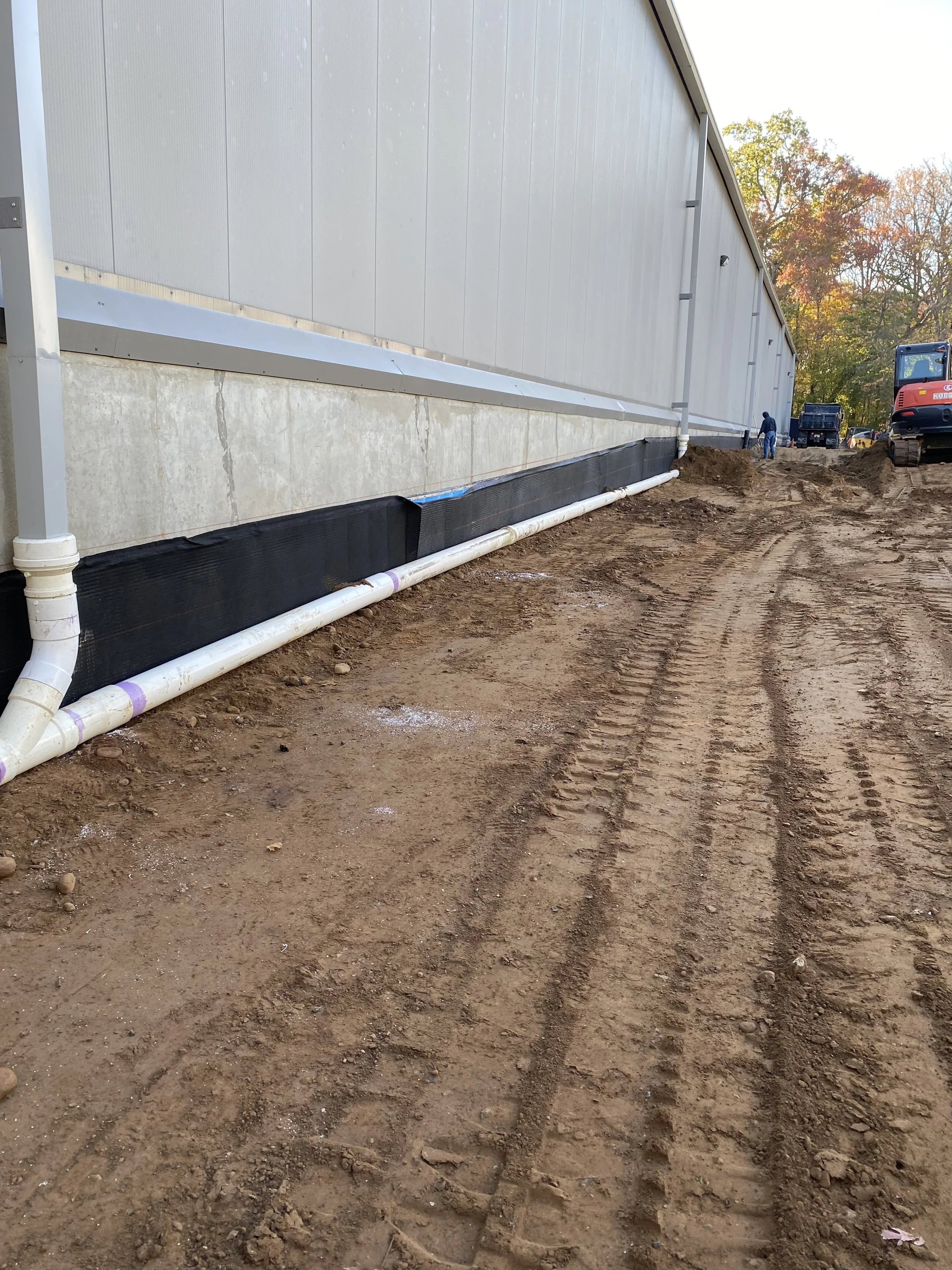 Exterior Drainage & Waterproofing: Installation of exterior foundation waterproofing and a new drainage system. 