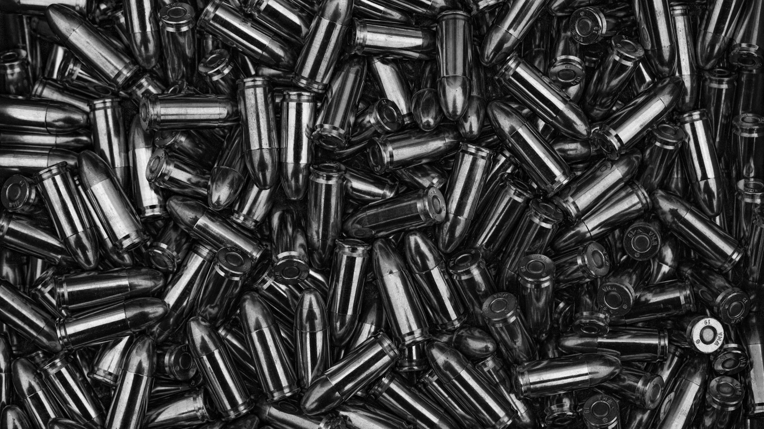 A large pile of metallic bullet casings.