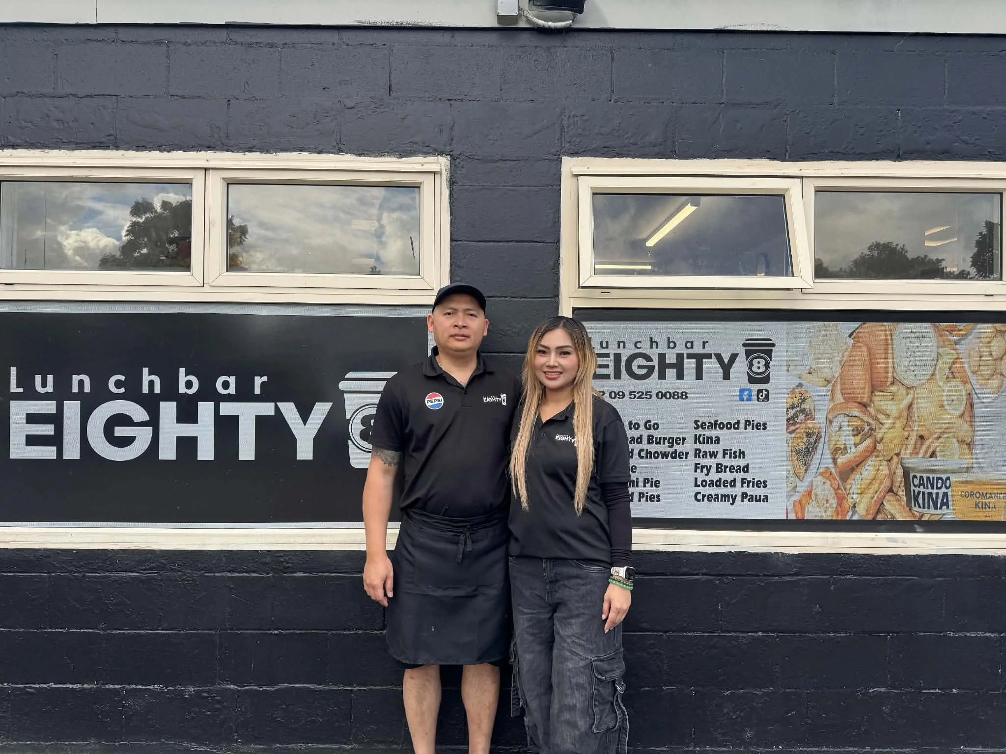 The founders of Lunchbar Eighty8 posing outside of their Lunchbar Eighty8 store.