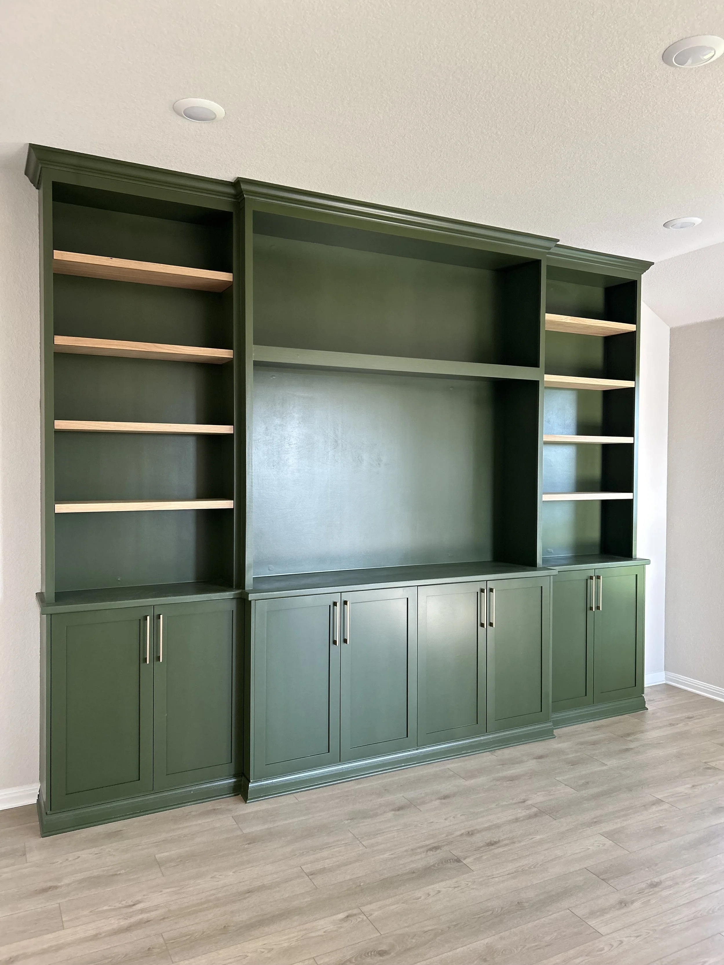 We were able to help this clients vision come to live for their custom media built ins. The went with this lovely rosemary green that made their room warm and inviting.
Looking for custom media built-ins in Kyle, Texas? Tell us about your space and w