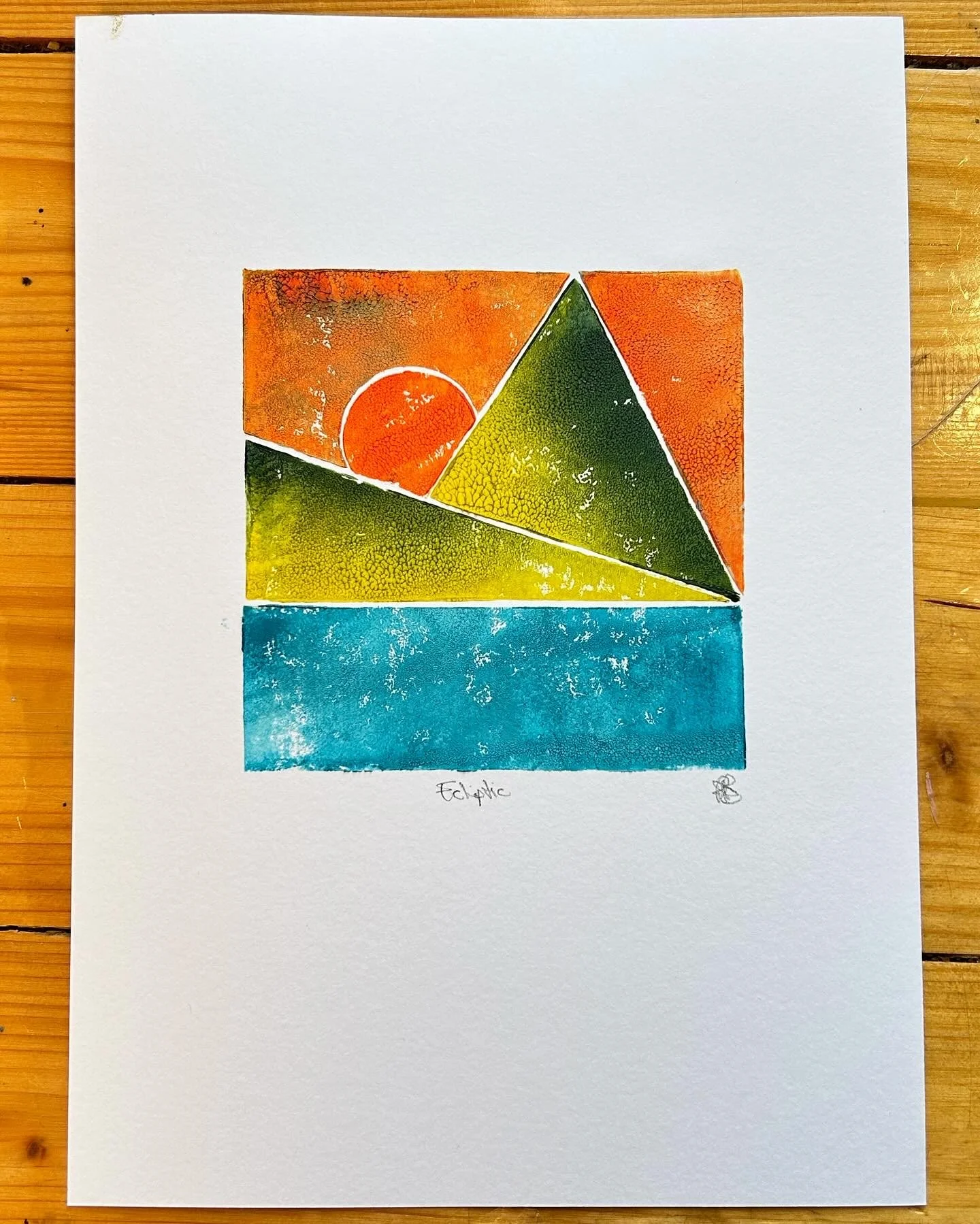 Abstract watercolor painting with geometric shapes and vibrant colors including orange, green, yellow, and blue, labeled 'Eclat' at the bottom.