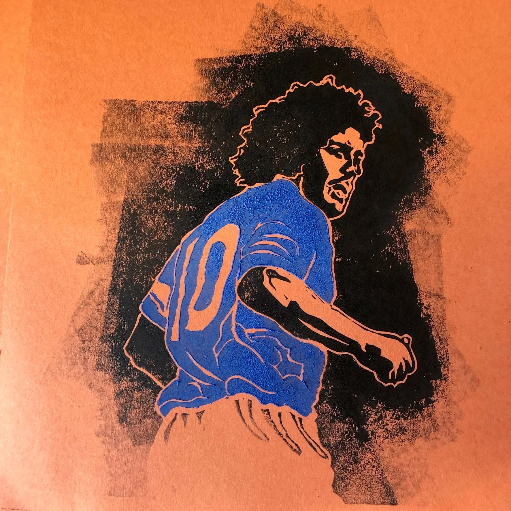 Street art illustration of a woman with curly hair, looking over her shoulder, with a blue shirt, on a textured orange wall.