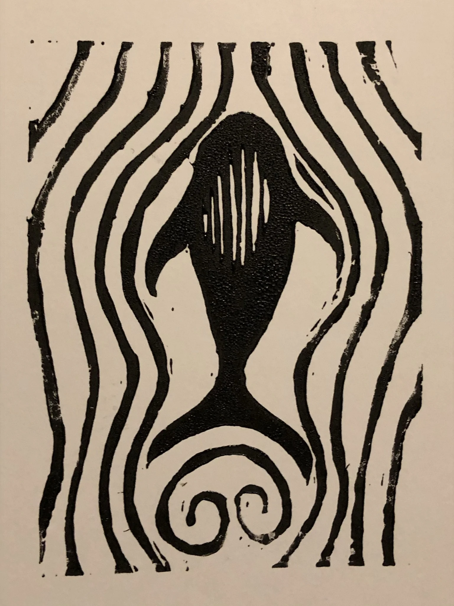 Black and white abstract art featuring a symmetrical design with curved lines and a central spiral pattern.