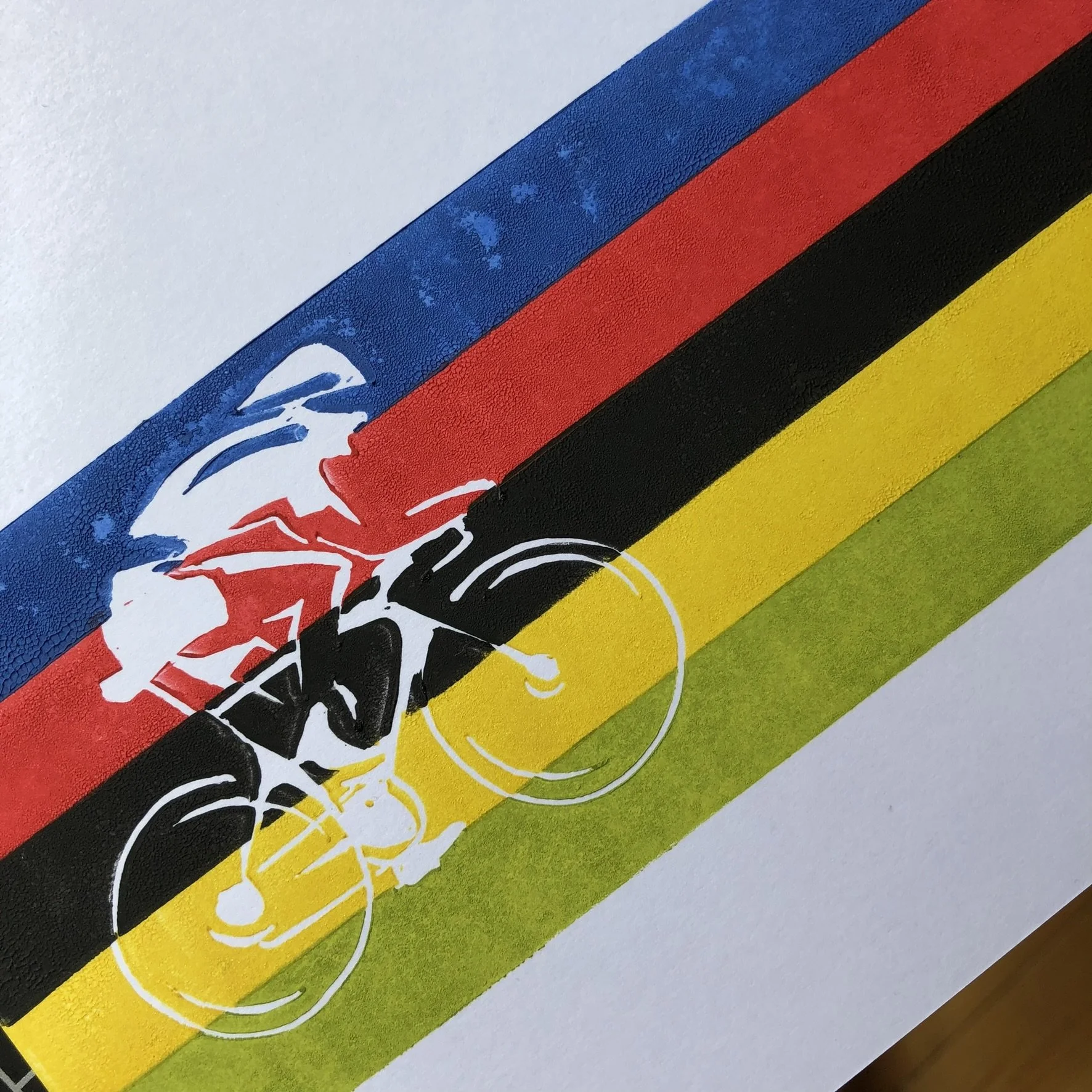 Close-up of a sketch featuring three horizontal bands of colors: blue, red, black, and yellow, with a green section at the bottom. There are white and black abstract lines and shapes overlaying the bands.