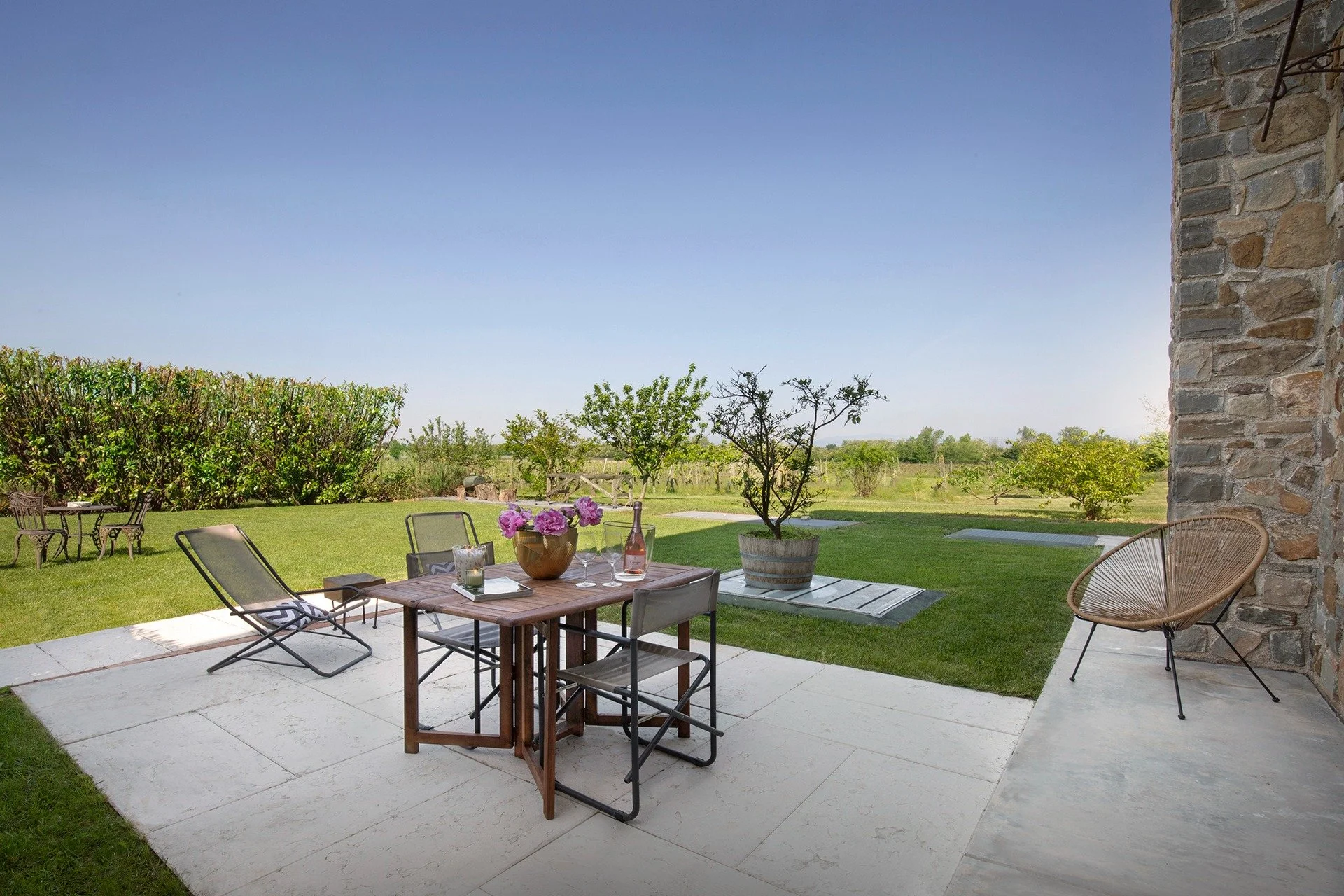 Garden patio with table and chairs overlooking the countryside