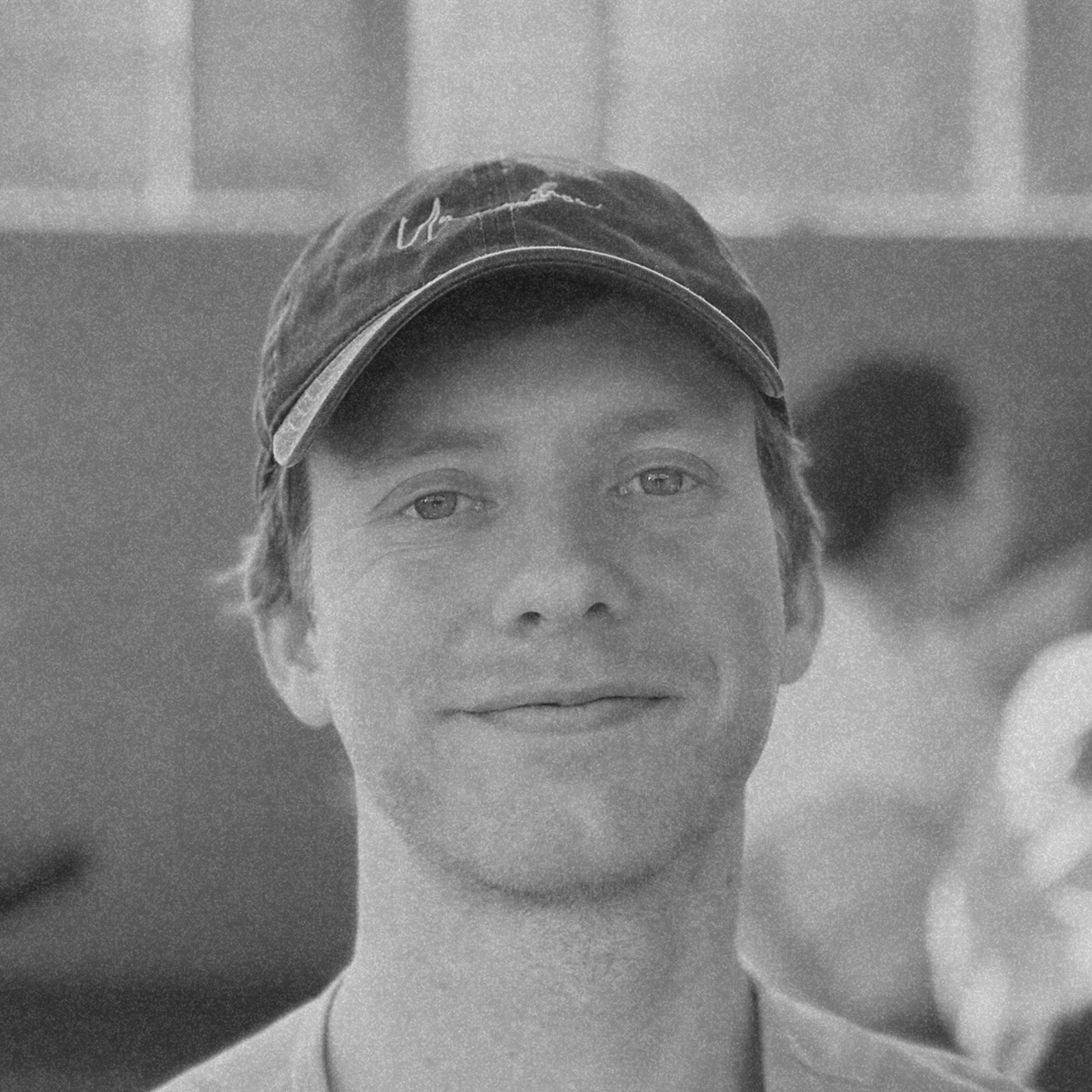 Black-and-white close-up portrait of Devin