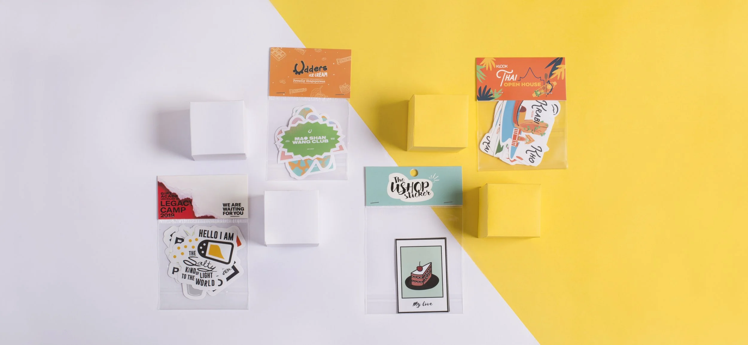 Custom sticker packs in resealable bags with printed header cards for Klook, Udders Ice Cream, UShop and Legacy Camp – branded die-cut vinyl sticker sets, Malaysia