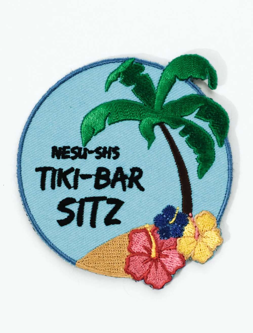 Woven patch made from fine tightly woven threads, giving a smooth flat surface for detailed artwork