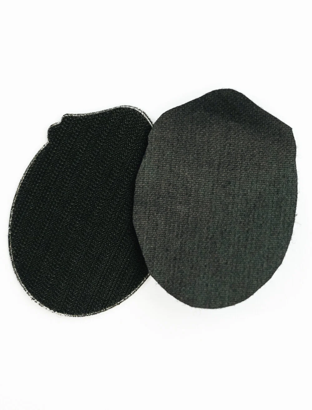 Patch with hook and loop backing, peeling away from its Velcro strip so it can be refitted repeatedly