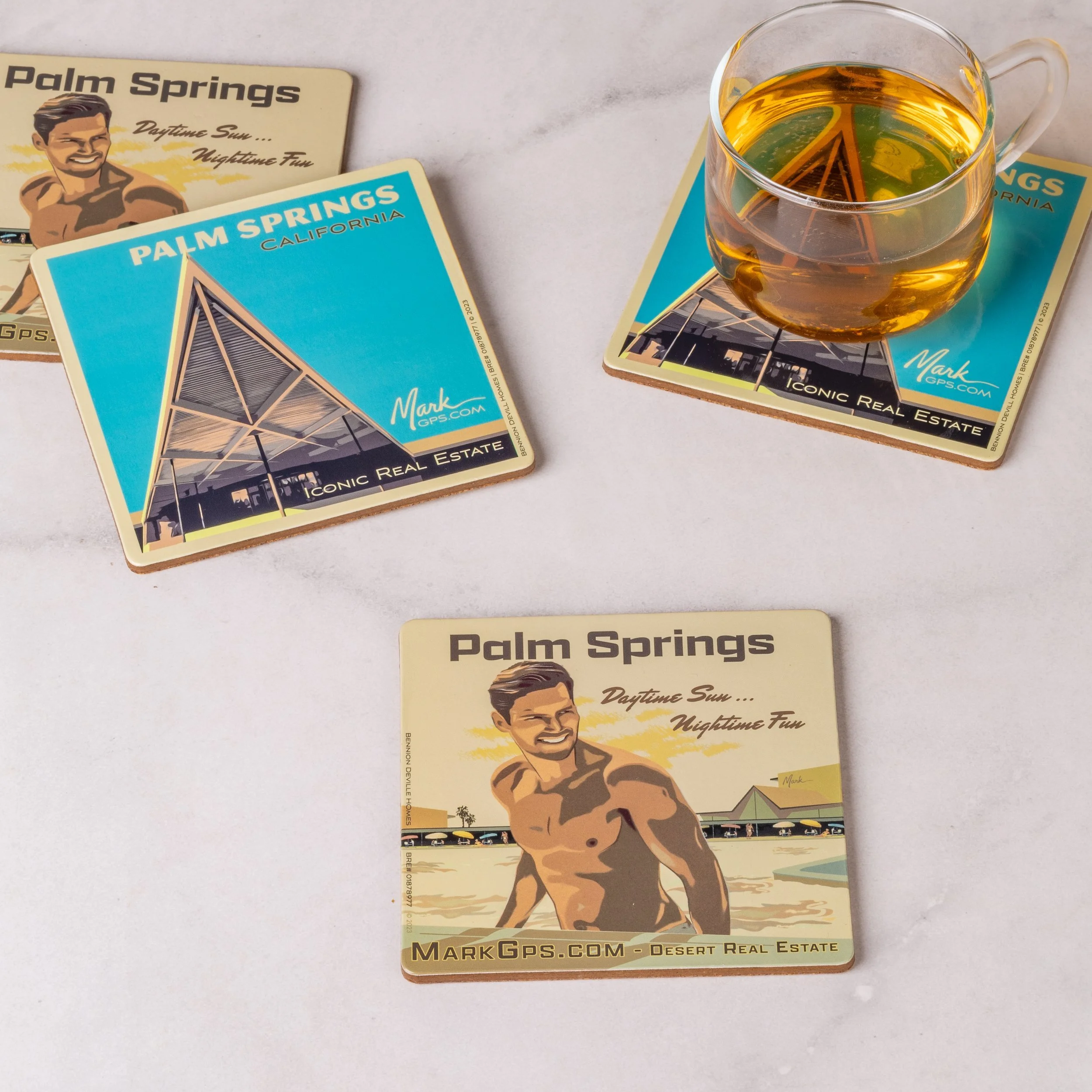 Square custom laminated coasters with vintage Palm Springs artwork under a glass of tea, real estate client promotional coasters, retail merchandise Malaysia