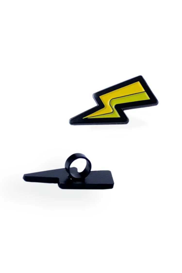 Black and yellow lightning bolt shoe charm in soft enamel