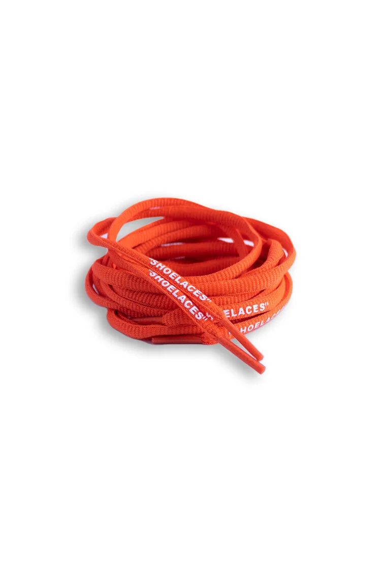 Coiled orange oval shoelaces printed with repeating white lettering