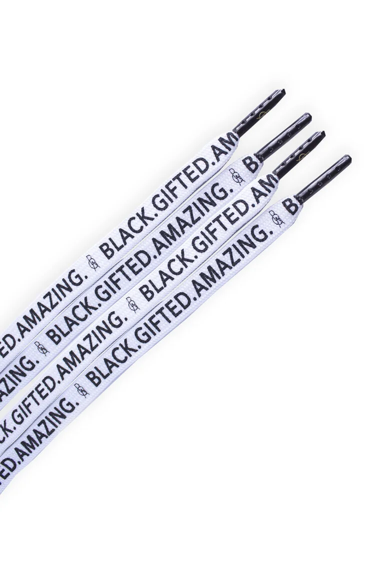 Screen printed shoelaces with thick black lettering on a white flat lace