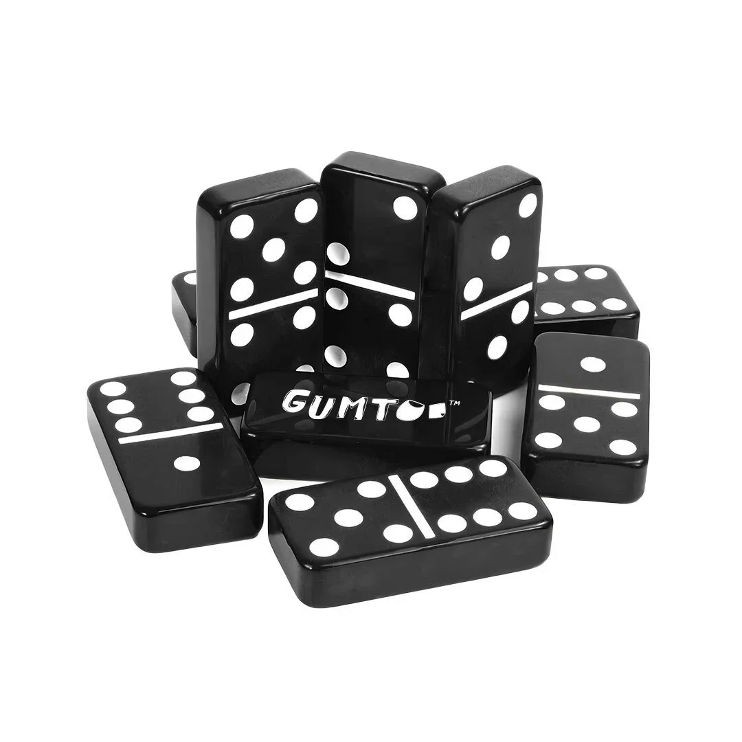 Custom black plastic domino tiles with white pips and printed logo, durable glossy branded set, retail merchandise Malaysia
